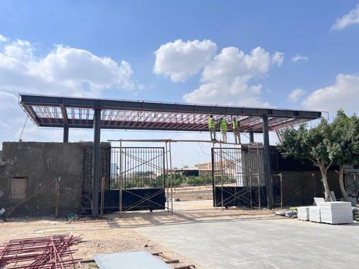 Crew working on the steel frame and rebar framing